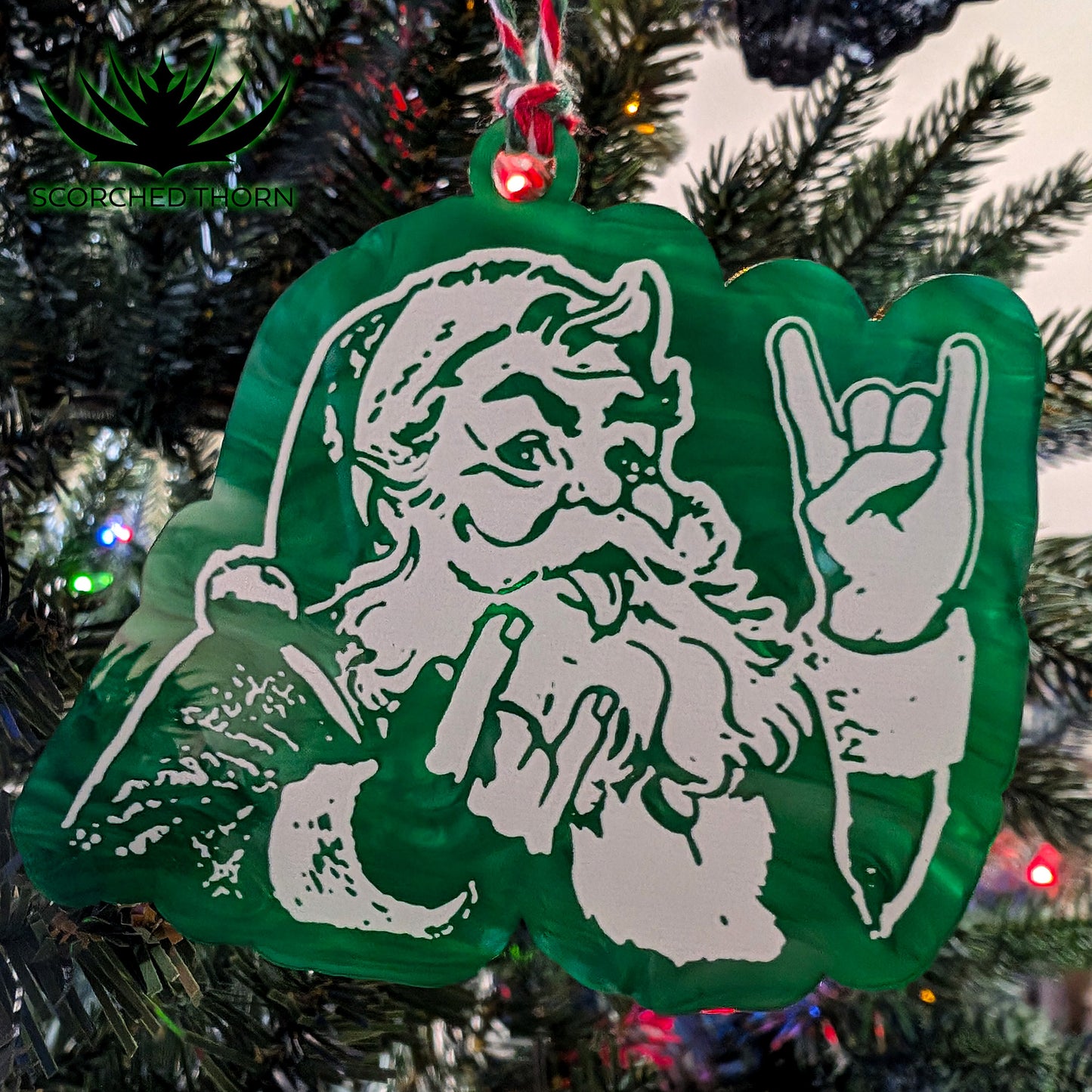 Rocker Santa® “Hail Santa Rocker” acrylic ornament on Christmas tree branch