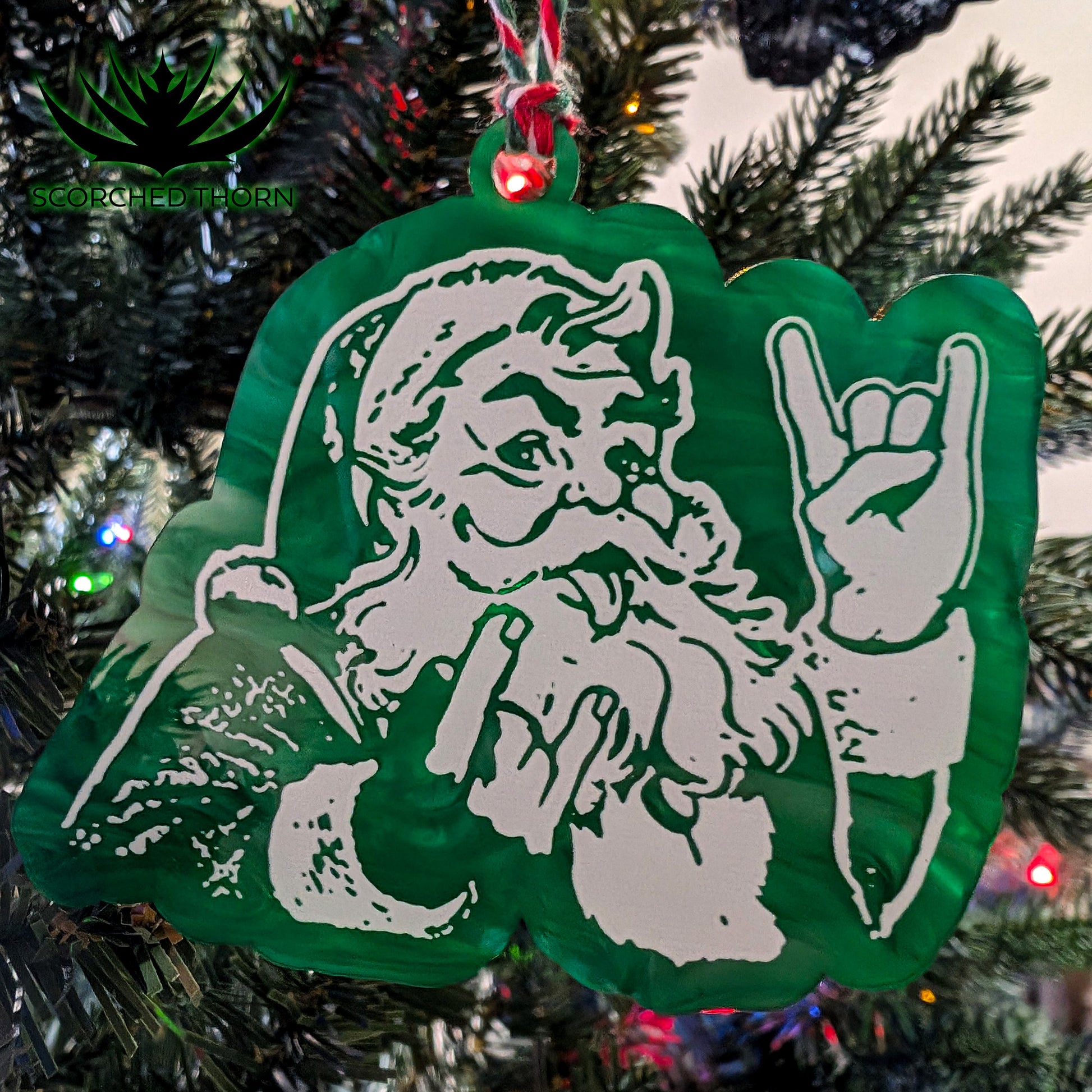 Rocker Santa® “Hail Santa Rocker” acrylic ornament on Christmas tree branch